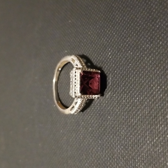 Sterling silver ring with purple colored stone - Picture 1 of 5